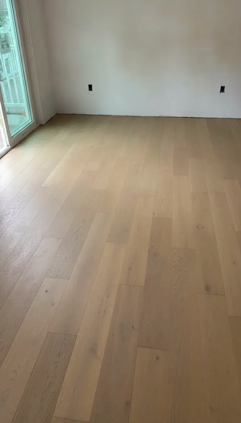 Finished white oak hardwood floor in a clean bright room
