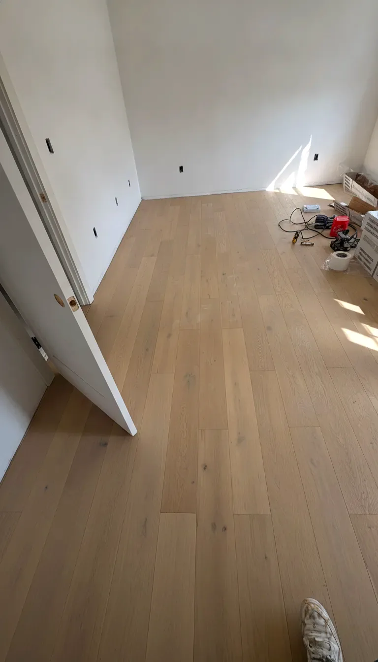 Finished white oak hardwood floor with warm natural light